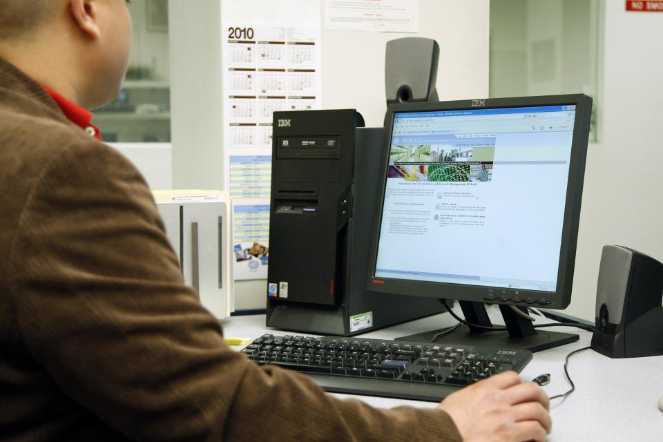 Image of Staff searching the archives