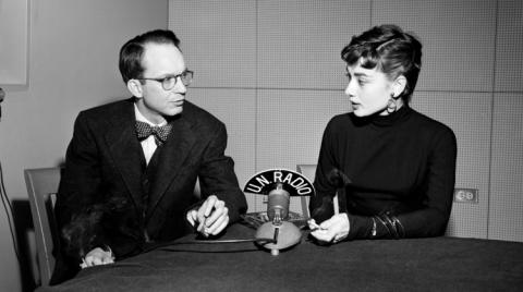 A photo of Audrey Hepburn interviewed by reporter William Oatis in 1953